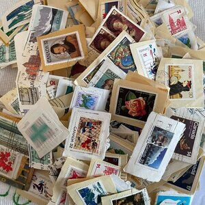 600 + CANADIAN POSTAGE STAMPS ON PAPER VINTAGE, for collecting or crafting